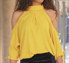 Mock Neck off shoulder long sleeve blouse with sleeve ties. Light Poly- Crepe fabric. This blouse can be styled for day and night wear! Perfect for a dinner date or for a fun night out! Designer Made in Los Angeles Solid Off-shoulder Blouse For Party, Solid Off-shoulder Top For Spring Party, Elegant Off-shoulder Top For Date Night In Spring, Fall Brunch Off-shoulder Top, Chic Solid Color Off-shoulder Blouse, Chic Off-shoulder Solid Color Blouse, Chic Off-shoulder Blouse, Off-shoulder Blouse For Evening, Chic Long Sleeve Off-shoulder Top