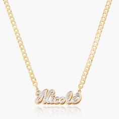 Our popular Double Plated Iced Out Script Name Necklace boasts a chic and elegant design, handcrafted to perfection. The model showcases the necklace with an 18-inch Cuban chain (see image for reference). Chain width:Cuban Chain - 3.7 mmFigaro Chain - 3 mmRope Chain - 2.3 mm Closure: All chains are fitted with a lobster clasp. Metal Selection: Gold Plated Silver Plated Sterling silver 14k gold plated over sterling silver 14k solid gold - (NAMEPLATE ONLY) Elegant Personalized Chain Link Necklace, Elegant Personalized Link Necklaces, Elegant Personalized Chain Link Necklaces, Personalized Yellow Gold Link Necklace, Elegant Personalized Cuban Link Chain Necklace, Elegant Pendant Necklace With Curb Chain, Figaro Chain Link Necklace Gift, Gold Nameplate Chain Jewelry, Silver Nameplate Chain Necklace With Adjustable Chain