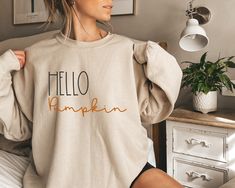 Hello Pumpkin Sweatshirt, Fall Sweatshirt, Fall Hoodie, Fall Crewneck, Pumpkin Sweatshirt, Pumpkin Patch Sweatshirt, Fall Apparel Hi! Welcome to my shop. I'm so glad to see you here. Your satisfaction is my main goal and I'm glad to answer any questions you might have about my products. -Personalization box is only for design color information. - If you want to add or change anything on the existing design that we show in the display picture, please contact the seller from the message box to ask Wife Sweater, Wife Sweatshirt, Wifey Sweatshirt, Augusta Georgia, Police Wife, Bride Shirt, Claire Fraser, Future Mrs, Cozy Sweatshirts