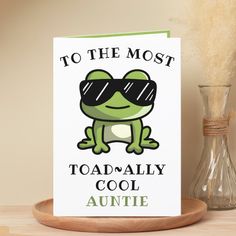 a greeting card featuring a cartoon frog wearing sunglasses and the words to the most toad - ally cool auntie