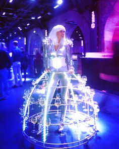 a woman standing on top of a glass display