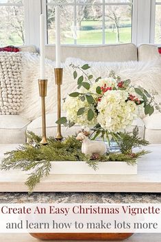 a living room decorated for christmas with candles, flowers and greenery on the coffee table