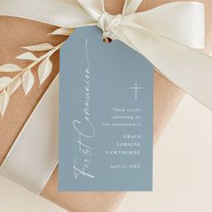 a gift wrapped in brown paper with a white ribbon and a tag on it that says, thank you for celebrating the first commandment of grace