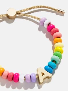 Shop the 
          Adjustable pull-tie bracelet 
        
Initial Beaded Slider Bracelet - Multi at the official Baublebar site. Excluded from Bracelet Offer. Casual Gold Beaded Charm Bracelet, Trendy Beaded Rainbow Friendship Bracelets, Adjustable Multicolor Everyday Jewelry, Casual Beaded Bangle Friendship Bracelets, Colorful Beaded Bracelets As Fashion Accessory, Polished Heishi Bead Bracelet, Trendy Rainbow Round Beads Jewelry, Trendy Rainbow Round Bead Jewelry, Trendy Multicolor Heishi Beads Jewelry