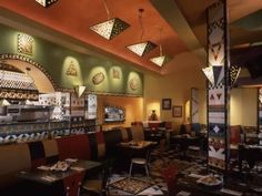 the interior of a restaurant with tables and booths