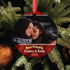 an ornament hanging on a christmas tree that says best friends emma and kelly