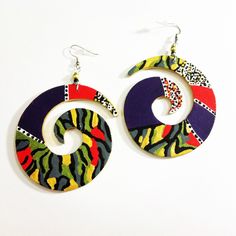 Hand painted with acrylic paints on lightweight wood  glossed with a clear gloss for protection..  Size 3in Handmade Spiral Wrap Earrings, Handmade Unique Spiral Wrap Earrings, Unique Handmade Spiral Earrings, Unique Handmade Spiral Wrap Earrings, Artsy Multicolor Pierced Earrings, Unique Spiral Hoop Earrings, Artistic Handmade Spiral Earrings, Handmade Multicolor Wrap Earrings For Gift, Artistic Multicolor Earrings With Unique Variations