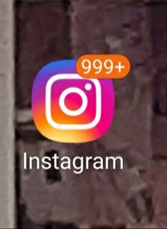 the instagram logo is displayed on an iphone