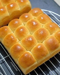 two pieces of bread sitting on top of a cooling rack