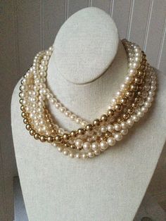 Vintage NAPIER bold and stunning multi strand torsade choker collar necklace.  This seven strand beauty has 5 strands of faux pearls in different sizes as well as 2 strands of gold plated beads.  All beads are in very good condition with the faux pearls having a gorgeous luster, and the golden beads bright and shiny.  There is a scuff mark at the edge of the clasp, but this does not diminish the true beauty of this piece! Vintage NAPIER costume jewelry was manufactured with craftsmanship, quality, and fashion conscious.  Many years of wearing enjoyment should be expected from these high end vintage pieces! Thanks for shopping alliesjewelbox.Etsy.com Jan Golden Beads, Choker Collar Necklace, Choker Collar, Vintage Pieces, Collar Necklace, Multi Strand, True Beauty