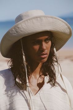 Made from 100% cotton canvas in a neutral beige tone, our new wide-brimmed holiday bucket is finished with a simple and secure necktie, ensuring this hat goes everywhere you do. Wide Brim Bucket Hat, Bucket Hat Design, Lack Of Color, Sun Protection Hat, Hat Design, Straw Hats, Halo Style, Cotton Hat, Wearing A Hat