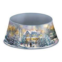 a christmas scene on a lamp shade with people walking in the snow near a house