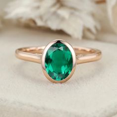 Discover timeless elegance with our Classic Solitaire 8x6mm Oval Cut Bezel Emerald Ring for Women in 14K Rose Gold, a symbol of style and sophistication. Oval Solitaire Ring In 14k Rose Gold, Elegant Oval Emerald Ring With Bezel Setting, 14k Rose Gold Solitaire Oval Jewelry, Oval Solitaire 14k Rose Gold Jewelry, 14k Rose Gold Oval Rings, Oval 14k Rose Gold Rings, Elegant Oval Rose Gold Emerald Ring, Elegant Rose Gold Oval Emerald Ring, Rose Gold Oval Ring For May Birthstone