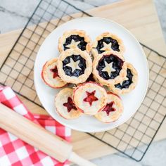 small patriotic pies on a white plate with a red and white checkered napkin