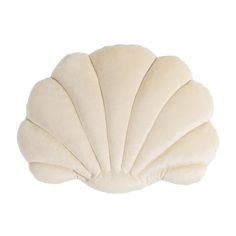 the shell shaped pillow is on display