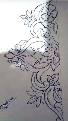 an artistically designed piece of paper with flowers and leaves drawn on the back of it