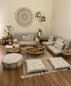 a living room filled with lots of furniture on top of a hard wood floored floor