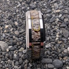 this is an image of a wedding ring made out of wood and metal