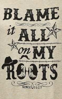 a t - shirt that says,'blame it all on my roots '