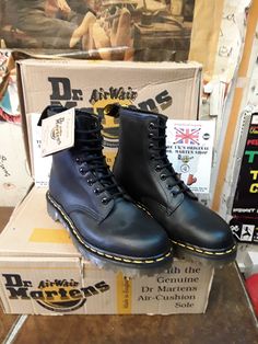 These are a premium pair of Made in England Dr Martens boots.  They were made back in the 1990s.  They are in pristine condition still. Dr Martens from this Era are considered their best. This boot is the Iconic 1460 model finished in a heavy black waxy leather.  They have the stronger commando sole bottom as well. So great on top as they are on the sole. They of course have trademark cushioned sole unit and yellow stitching.  These are a UK size 5, European 38,ladies USA 7 High-top Steel Toe Boots For Streetwear, Steel Toe Ankle-high Boots For Streetwear, Classic High-top Boots For Streetwear, Classic Ankle-high Boots For Streetwear, Classic Steel Toe Combat Boots For Streetwear, Classic Combat Boots With Steel Toe For Streetwear, Casual Steel Toe Boots For Streetwear, Casual Streetwear Boots With Steel Toe, Vintage Boots With Vibram Sole For Streetwear