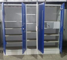 three metal storage cabinets with blue doors in a warehouse or office building, one opened and the other closed