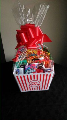 a basket filled with candy and candies on top of a table