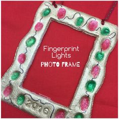 a white frame with pink, green and red decorations on it that says fingerprint lights photo frame