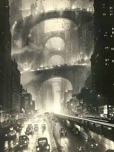 an old black and white photo of a city at night with cars driving on the street