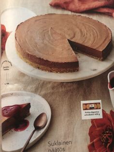 a magazine with a chocolate cake on the cover and two plates full of desserts next to it