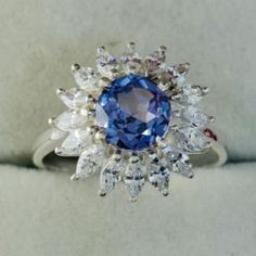 a blue and white ring sitting on top of a table