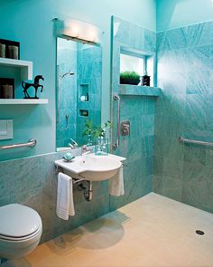 a bathroom with blue walls and white fixtures