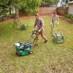 two men are mowing the lawn with their lawnmowers and one man is using a weeder