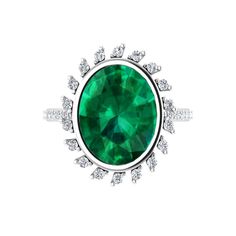 This stunning engagement ring is studded with certified conflict-free natural diamonds and emerald gemstone. Crafted in 14K solid gold. Total Carat weight: 8.01 carats. Center stone carat weight: 7.35 carat. Gemstone grade: AAA. Size of gemstone: 13.20 mm x 11.20 mm. Gemstone treatment: Oiling. Side diamonds weight: 0.66 carats. Side diamonds clarity and color: VS, G-H. Customizable in metals of choice. Band width: 1.4 mm. Ring features a natural emerald gemstone. Designed in Austin, Texas. Made Glamorous Engagement Rings, Emerald Diamond Engagement Ring, Emerald Ring Engagement Diamond, Stunning Engagement Ring, Signature Jewelry, Fine Jewelry Designers, Emerald Gemstone, Natural Emerald, Emerald Diamond