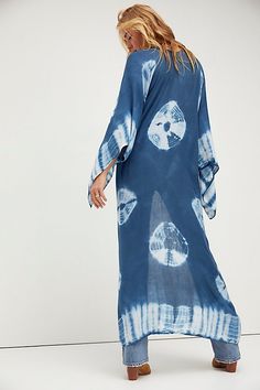 In a super soft fabric and tie dye pattern this oversized maxi kimono features statement cutout detailing under the arms. Flowy Long Cover-up For Vacation, Long Flowy Cover-up For Vacation, Blue Breezy Flowy Cover-up, Blue Flowy Breezy Cover-up, Flowy Unlined Cover-up For Vacation, Bohemian Lightweight Cover-up For Beach Party, Oversized Bohemian Cover-up For Loungewear, Bohemian Oversized Cover-up For Loungewear, Bohemian Rayon Cover-up For Vacation