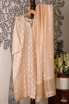 Regal Peach coloured Boteh (boota) Kurta Dupatta set with running floral motif on the front body. The back has small floral bootis to give an overall neat look to the ensemble. A Chanderi dupatta matches the floral bootis on the body the kurta back. Lace detailing adds to the beauty of the ensemble. Stitching of the Kurta is complimentary by Meiraas, along with cotton detachable slip. We have just 1 piece in this ensemble that can be made from S - XXL, so leave your size in the Customer Note, as per our size chart given. The Sustainability Quotient (SQ): 1. Skilled Resham Hand Embroidery 2. Antique hand carved wooden hand block motif printing, following all processes 3. Handloom Chanderi fabric ARTISANAL CHIKANKARI BY MEIRAAS KHAYAL (moodboard): Boteh or Boota is the backbone of the crafts Luxury Bohemian Dupatta With Chikankari Embroidery, Unstitched Kurta With Chikankari Embroidery In Slub Silk, Designer Slub Silk Dupatta With Chikankari Embroidery, Transitional Chikankari Embroidery Sets In Slub Silk, Festive Salwar Kameez With Chikankari Embroidery In Slub Silk, Raw Silk Sharara With Chikankari Embroidery, Designer Tussar Silk Kurta With Chikankari Embroidery, Festive Tussar Silk Kurta With Chikankari Embroidery, Tussar Silk Kurta With Chikankari Embroidery