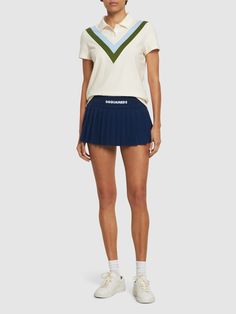 Elastic logo waistband. Ruffled hem. Model is wearing a sizeS Luxury Blue Pleated Mini Skirt, Knit Logo, Versace Brand, Asymmetrical Skirt, Flat Espadrilles, Green Skirt, Pleated Mini Skirt, Shearling Jacket, Ski Wear