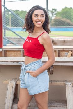 Celebrate the Fourth of July with our new USA Crop Top! This new arrival features a soft knit material, a square neckline, cami adjustable straps, and a cropped length. Pair this one with your favorite denim! Available in navy and red. cotton nylon hand wash with cold water lay flat to dry iron if needed Models are wearing a size small Casual Crop Top With Tank Straps, Red Trendy Camisole Crop Top, Trendy Red Camisole Crop Top, Red Casual Camisole Crop Top, Casual Red Camisole Crop Top, Red Camisole Crop Top Casual Style, Casual Red Tank Strap Tops, Casual Red Crop Top, Casual Cotton Camisole Crop Top