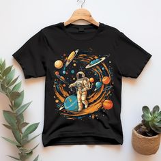 astronaut shirt, planets tshirt, colorful shirt, space themed tee, Women Shirt, Men Shirt, ot shirt, alternative shirt, gift for boyfriend shirt, gift for dad shirt BELLA CANVAS UNISEX ADULT SHIRTS DESIGN/FABRIC/CARE INFO * This updated unisex essential fits like a well-loved favorite. Super soft cotton and excellent quality print makes one to fall in love with it over and over again. * 100% Airlume combed and ringspun cotton (fiber content may vary for different colors. Solid colors are 100% cotton, heather colors are 52% cotton, 48% polyester (Athletic Heather and Black Heather are 90% cotton, 10% polyester) * Light fabric (4.2 oz/yd² (142 g/m * Retail fit, tear away label, runs true to size * Machine wash: warm (max 40C or 105F); Non-chlorine: bleach as needed; Tumble dry: low heat; Iro Space Tee, Tshirt Printing Design, Space Shirts, Shirts Design, Gift For Boyfriend, Adulting Shirts, Boyfriend Shirt, Men Shirt, Design Fabric