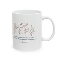 a white coffee mug with the bible verse on it