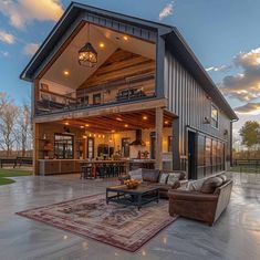 a large open floor plan with lots of windows and furniture in the living room area