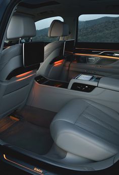 the interior of a car with its lights on