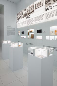 an exhibit room filled with lots of white boxes