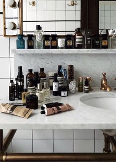 the bathroom counter is full of personal care products