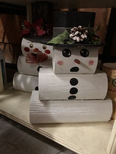 snowman made out of toilet paper sitting on top of a shelf