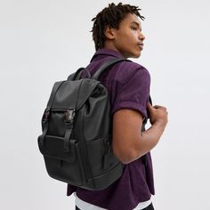 Made for a life in constant motion the League keeps your game plan on track. Crafted of smooth leather this roomy backpack is a comfortable choice for every day with its padded back and straps. Organized with multiple pockets inside and out the sporty style has a dedicated laptop sleeve and plenty of space for notebooks water bottles and other essentials. An exterior zipper gives easy access to the main compartment. | Coach League Flap Backpack - Charcoal Sporty Backpack With Multiple Pockets, Sporty Standard Backpack With Multiple Pockets, Functional Leather Backpack, Sporty Black Leather Backpack, Sporty Outdoor Backpack With Multiple Pockets, Functional Leather Backpack For Back To School, Modern Backpack With Adjustable Strap For Outdoor Activities, Leather Travel Backpack With Functional Pockets, Leather Outdoor Backpack With Functional Pockets