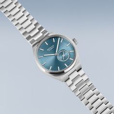 Crafted from stainless steel with link bracelets, the BERING ladies' watch embodies the brand's signature cool and minimalist style. Every detail of this design piece reflects the innovation and timeless design that BERING is known for. The iconic Arctic Blue sunray dial is adorned with luminous white and silver-colored indices and hands that ensure optimal legibility. A white tip on the second hand adds a touch of contrast and reflects the pristine beauty of the Arctic. The transparent case bac Modern Everyday Watches With Metal Dial, Modern Silver Watches With Polished Finish, Minimalist Silver Watch With Subdials, Silver Everyday Watch With Polished Finish, Modern White Gold Automatic Watch, Modern White Gold Automatic Watches, Modern Silver Watches With Stainless Steel Clasp, Minimalist Stainless Steel Watch With Polished Finish, Modern Silver Watch For Everyday