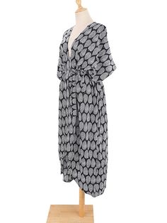 The Sage Moonlight Kimono is the perfect way to complete your look! Its classic design and beautiful pattern will make you look stylish and put-together wherever you go. Rock it with jeans and a top or use it as a robe or beach cover-up - it's to die for! Get your hands on this vintage-chic kimono and give your wardrobe some boho flair! Specs: Material: Rayon Casual Black V-neck Kimono, Casual Black Open Front Cover-up, Casual Black Kimono For Day Out, One Size Black Cover-up For Summer, Black One-size Summer Cover-up, Oversized Black Bohemian Cover-up, Black Open Front Cover-up For Vacation, Black Wrap Beach Cover-up, Black Wrap Cover-up For Spring