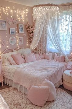 a bedroom decorated in pink and white with fairy lights