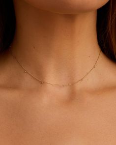 Dainty and sophisticated, yet simple enough for everyday wear, the Diamond Dot Flutter Choker features bezel set diamonds set on an adjustable solid gold chain. It's the perfect finishing touch to any outfit - we love this choker paired with longer length chain necklaces for a fully layered look. Diamond Dot Flutter Choker Necklace in 14k Solid Gold, Women's by gorjana Simple Choker Necklace Designs, Simple Choker Necklace, Earrings Stacking, Dainty Choker Necklace, Choker Necklace Designs, Dot Necklace, Dainty Choker, Diamond Choker, Solid Gold Chains