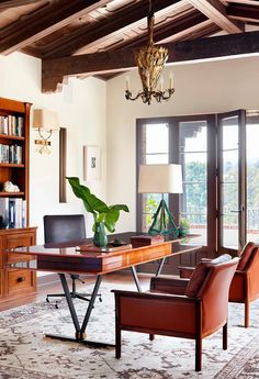 a living room filled with furniture and a large window